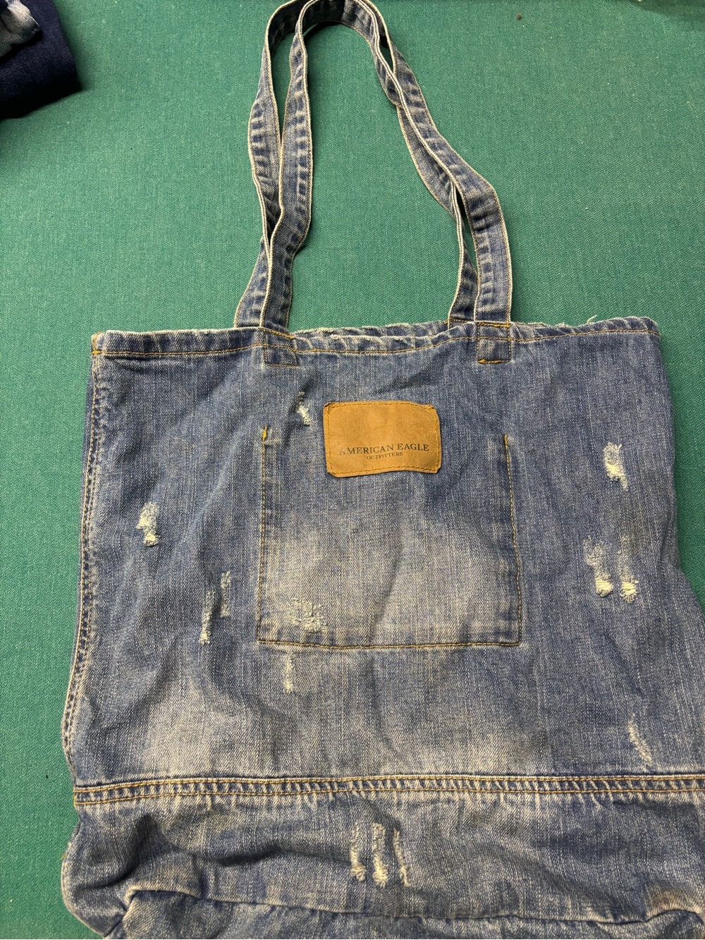 American Eagle Outfitters Distressed Denim Messenger Tote in Blue with Tan Patch
